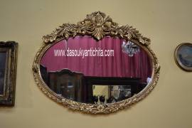 Specchiera dorata ovale stile Barocco
