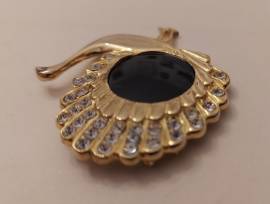 Centrale in argento dorato 800 a forma di pavone con onice nero incastonato 