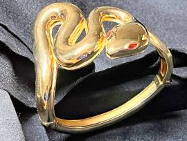 Bracciale serpente in argento 925 placcato oro 18Kt con peredoti rossi negli occhi 