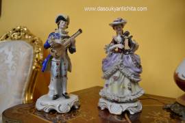 Coppia di statuine in porcellana  raffiguranti musicanti