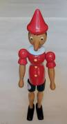 Pinocchio in legno, dipinto a mano e completamente snodabile, lunghezza: 30 cm. Fabbricato in Italia