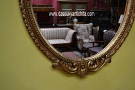 Specchiera ovale dorata stile Barocco