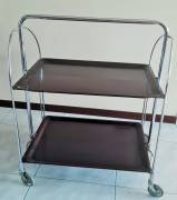 Carrello GERLINOL pieghevole, prodotto tedesco degli anni ’60. La struttura è cromata e i due ripian