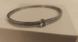 Bracciale donna rigido chiusura a scatto con piccoli zirconi inseriti e pietra centrale nuovo